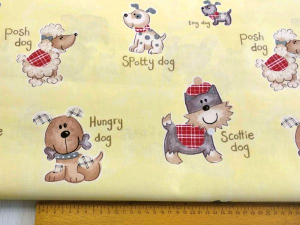Stoff gelb mit Hunden